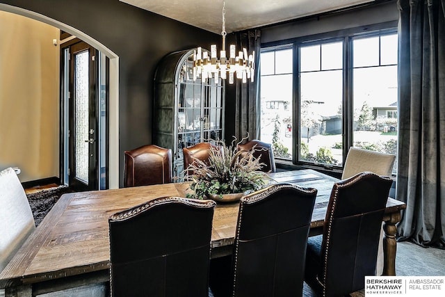 3334 S 188th Ave, Omaha, NE 68130 - dining room featuring arched walkways and a chandelier