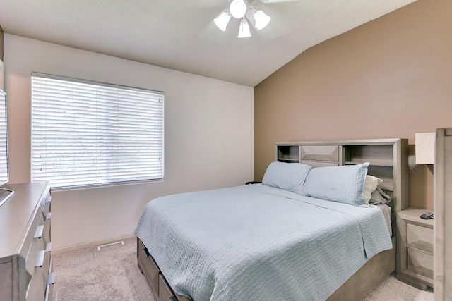 6704 N 149th Ave, Omaha, NE 68116 - bedroom with light colored carpet, vaulted ceiling, ceiling fan, and baseboards