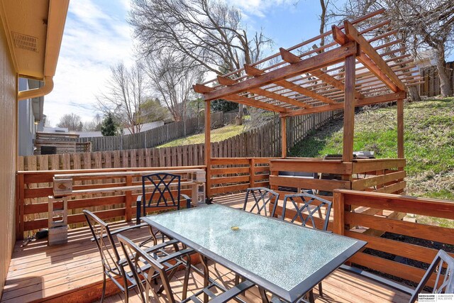 6704 N 149th Ave, Omaha, NE 68116 - wooden terrace featuring a fenced backyard, a pergola, and outdoor dining space