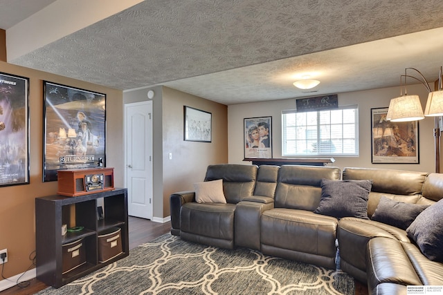 6704 N 149th Ave, Omaha, NE 68116 - living area featuring dark wood-type flooring, a textured ceiling, and baseboards