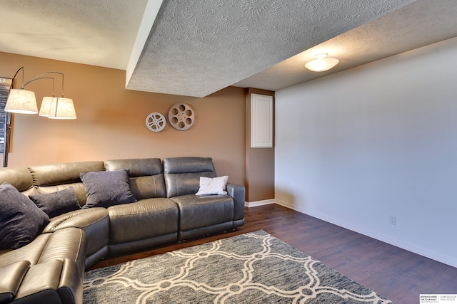 6704 N 149th Ave, Omaha, NE 68116 - living room featuring wood finished floors, baseboards, and a textured ceiling