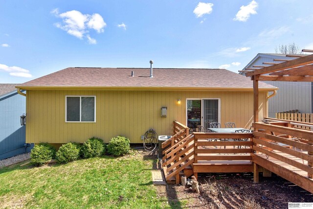 6704 N 149th Ave, Omaha, NE 68116 - back of property with a shingled roof, a pergola, a deck, and a lawn
