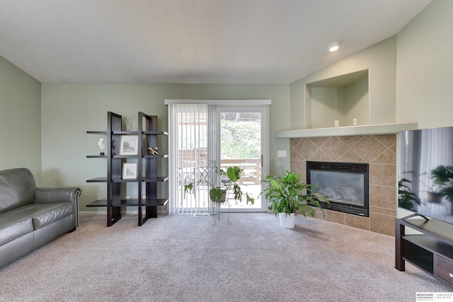 6704 N 149th Ave, Omaha, NE 68116 - living area featuring carpet flooring and a tiled fireplace