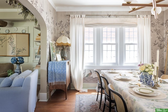 5147 Davenport St, Omaha, NE 68132 - dining area featuring wallpapered walls, wood finished floors, arched walkways, baseboards, and stairway