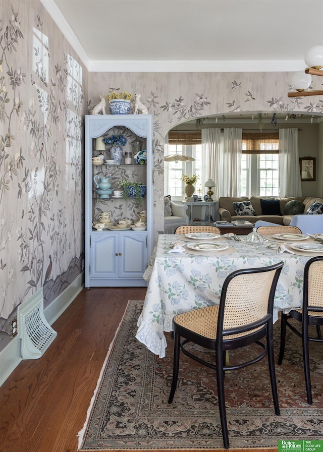 5147 Davenport St, Omaha, NE 68132 - dining space featuring wallpapered walls, dark wood-type flooring, and ornamental molding