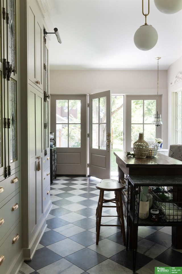 5147 Davenport St, Omaha, NE 68132 - foyer featuring dark floors, healthy amount of natural light, and a chandelier