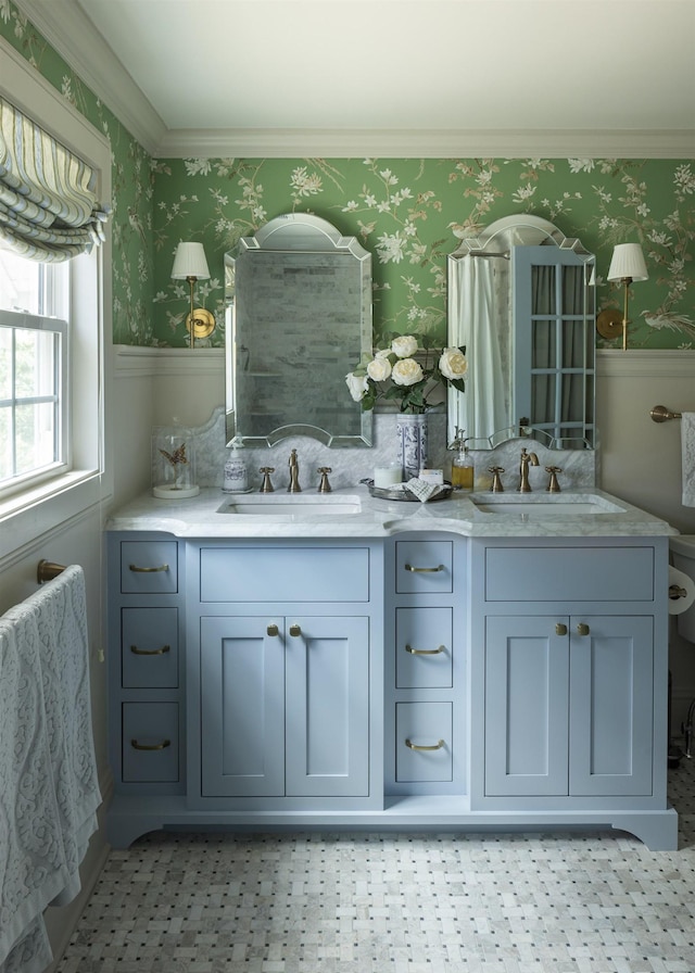 5147 Davenport St, Omaha, NE 68132 - bathroom featuring wallpapered walls, wainscoting, double vanity, and ornamental molding