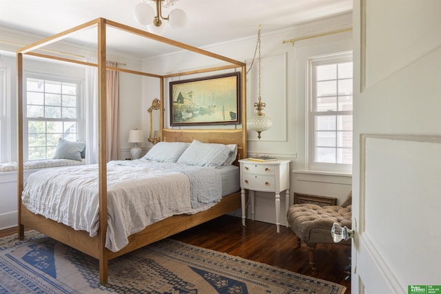 5147 Davenport St, Omaha, NE 68132 - bedroom with wood finished floors, multiple windows, and ornamental molding