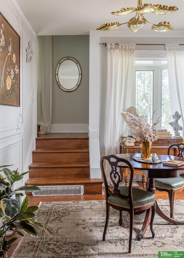 5147 Davenport St, Omaha, NE 68132 - dining room with wood finished floors, stairway, and baseboards