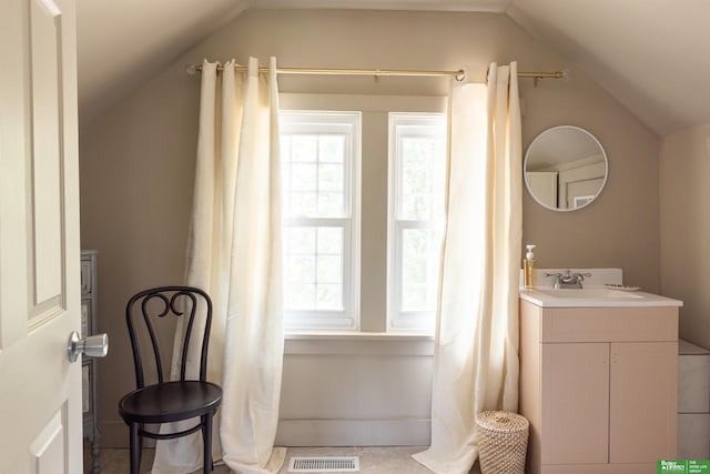 5147 Davenport St, Omaha, NE 68132 - full bathroom with vaulted ceiling, plenty of natural light, and vanity