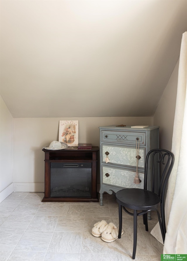 5147 Davenport St, Omaha, NE 68132 - living area featuring vaulted ceiling and baseboards