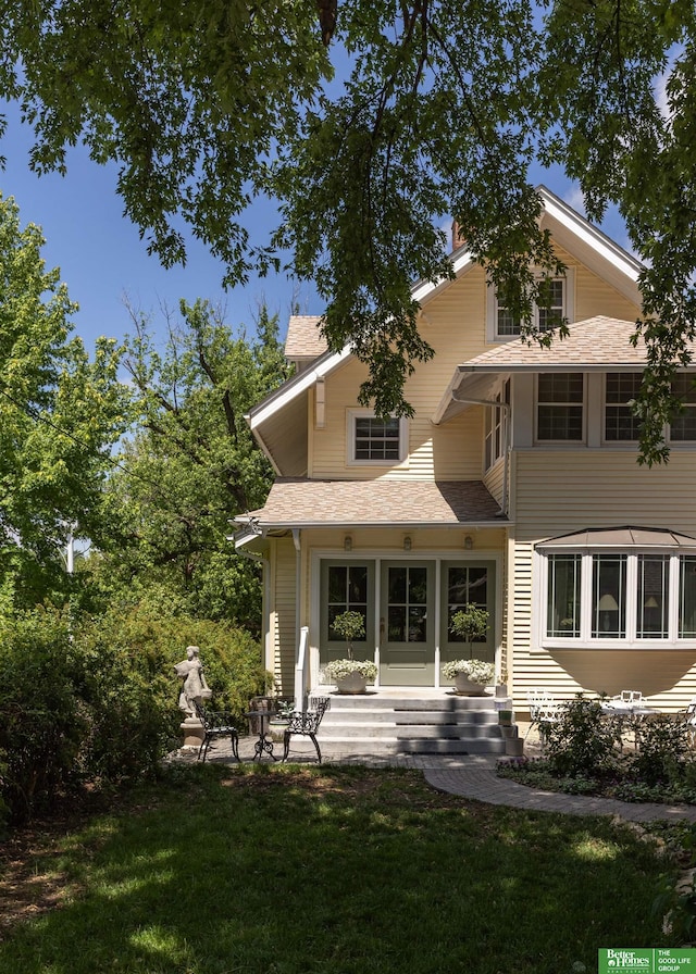 5147 Davenport St, Omaha, NE 68132 - rear view of property featuring a yard