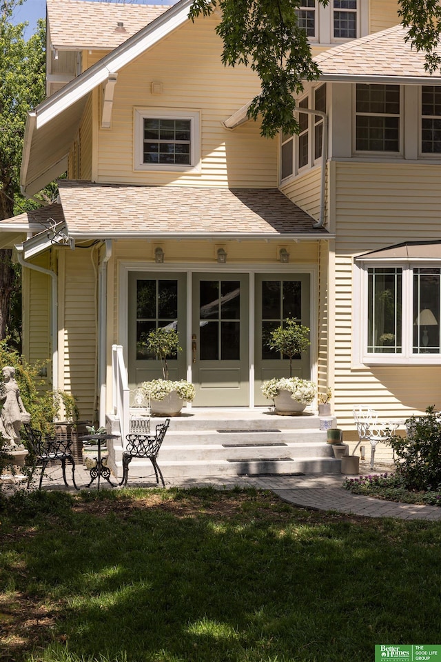 5147 Davenport St, Omaha, NE 68132 - rear view of house featuring a lawn