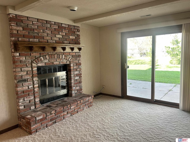 5418 Thies Cove Dr, Lincoln, NE 68516 - unfurnished living room with carpet, beam ceiling, a fireplace, a textured ceiling, and baseboards