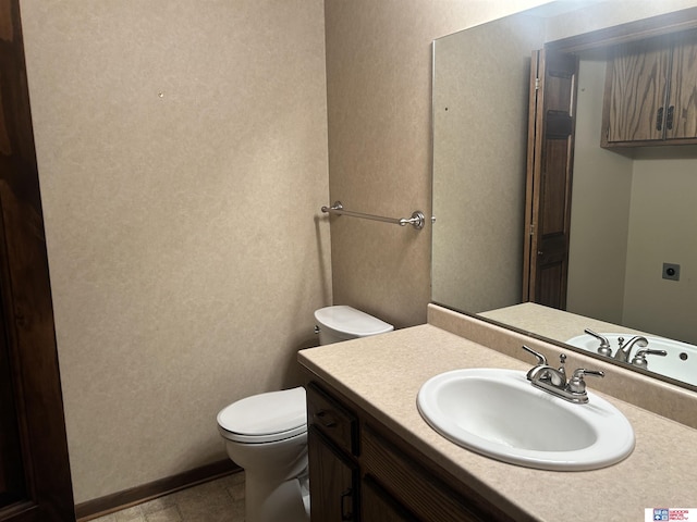 5418 Thies Cove Dr, Lincoln, NE 68516 - bathroom with toilet, vanity, and a textured wall