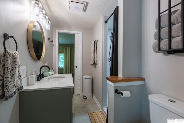 605 2nd St, Waterloo, NE 68069 - full bath with toilet, vanity, tile patterned floors, and a shower