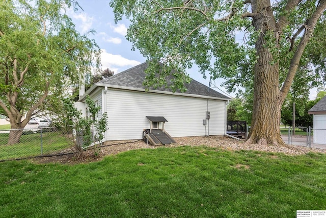 605 2nd St, Waterloo, NE 68069 - view of home's exterior with roof with shingles and a gate