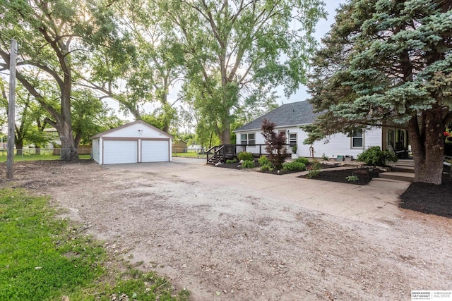 605 2nd St, Waterloo, NE 68069 - view of side of property featuring an outbuilding, a garage, and a deck