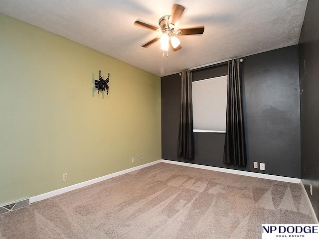 12067 Patrick Ave, Omaha, NE 68164 - carpeted spare room featuring ceiling fan and baseboards