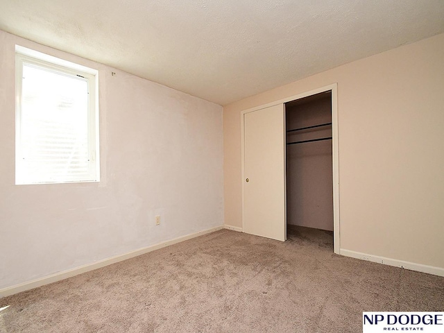 12067 Patrick Ave, Omaha, NE 68164 - unfurnished bedroom featuring carpet, a closet, and baseboards