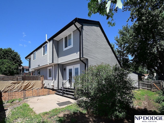 12067 Patrick Ave, Omaha, NE 68164 - rear view of house with french doors and a patio area