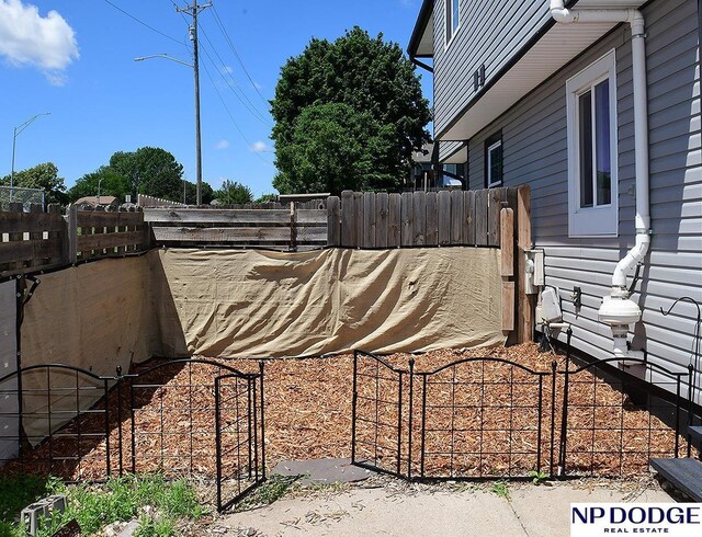 12067 Patrick Ave, Omaha, NE 68164 - view of side of home featuring a gate