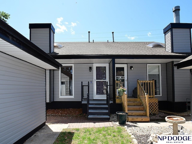 12067 Patrick Ave, Omaha, NE 68164 - doorway to property with roof with shingles, a porch, and a chimney
