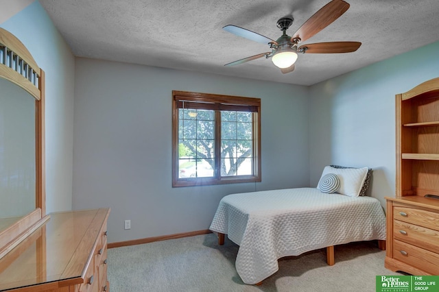 17139 S St, Omaha, NE 68135 - bedroom with light colored carpet, baseboards, a textured ceiling, and a ceiling fan