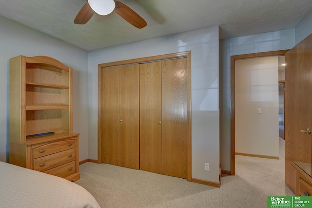 17139 S St, Omaha, NE 68135 - bedroom featuring light colored carpet, a closet, baseboards, and ceiling fan