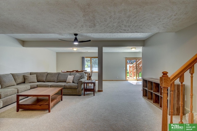 17139 S St, Omaha, NE 68135 - living room featuring light carpet, a textured ceiling, ceiling fan, baseboards, and stairway