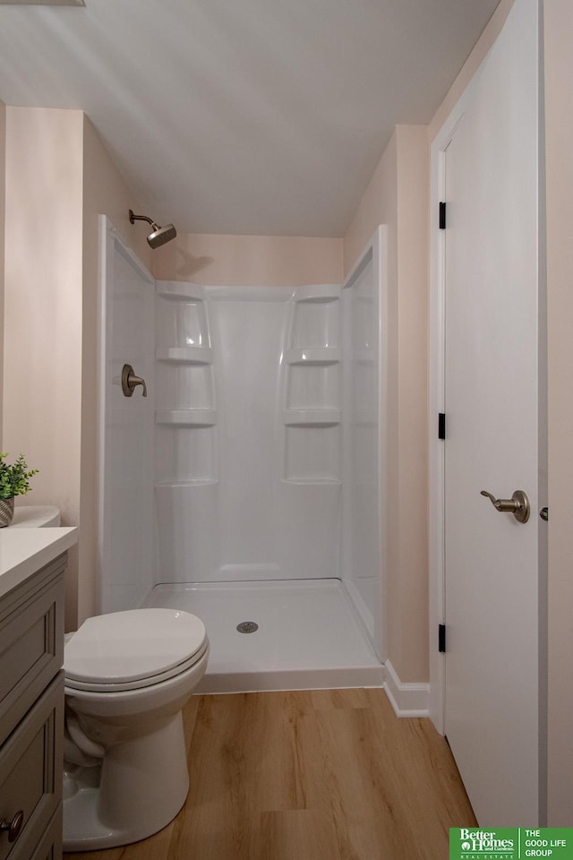 17139 S St, Omaha, NE 68135 - full bathroom with vanity, wood finished floors, a shower, and toilet