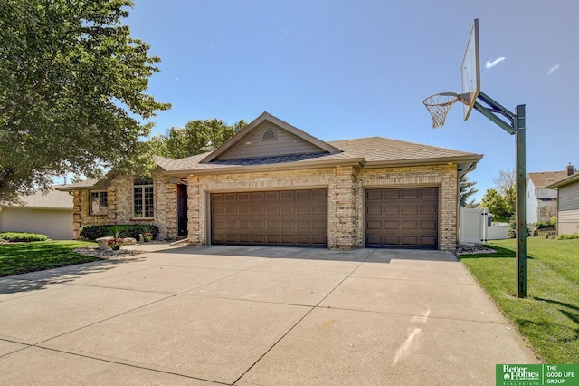 17139 S St, Omaha, NE 68135 - view of front facade featuring an attached garage, a front yard, concrete driveway, and brick siding