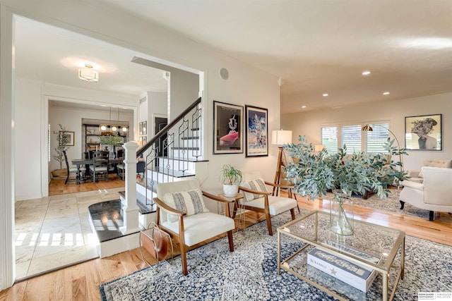 3814 S 186th Ave, Omaha, NE 68130 - living area with wood finished floors, stairway, a chandelier, and recessed lighting