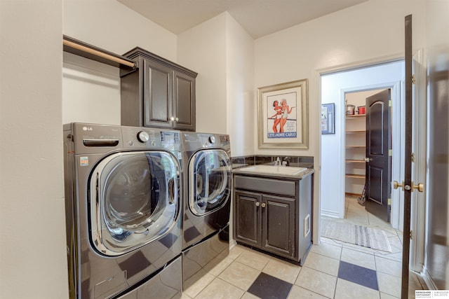3814 S 186th Ave, Omaha, NE 68130 - washroom with cabinet space, separate washer and dryer, and light tile patterned flooring