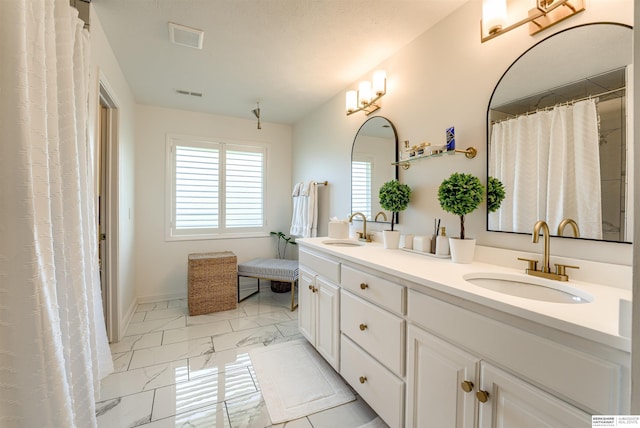 3814 S 186th Ave, Omaha, NE 68130 - bathroom with marble finish floors, double vanity, and baseboards