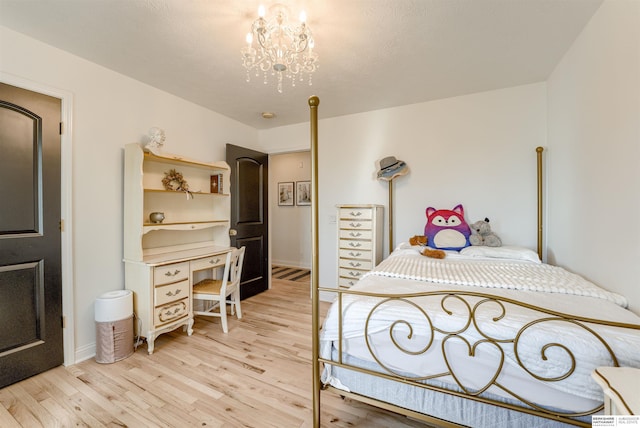 3814 S 186th Ave, Omaha, NE 68130 - bedroom featuring light wood-style floors and a chandelier