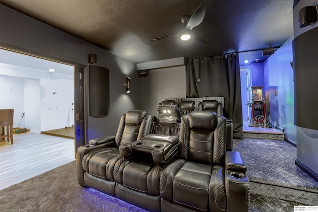 3814 S 186th Ave, Omaha, NE 68130 - cinema room featuring a ceiling fan, carpet, baseboards, and wood finished floors