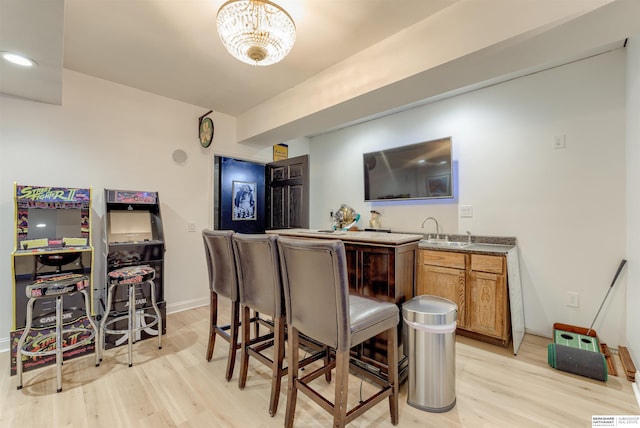 3814 S 186th Ave, Omaha, NE 68130 - indoor wet bar with light wood finished floors and baseboards
