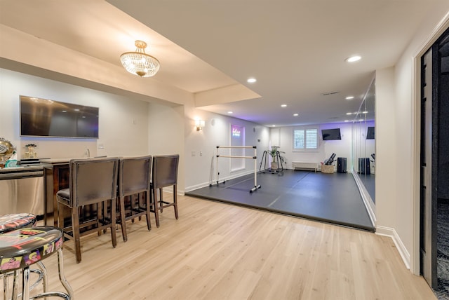 3814 S 186th Ave, Omaha, NE 68130 - exercise area featuring wood finished floors, recessed lighting, baseboards, and a chandelier