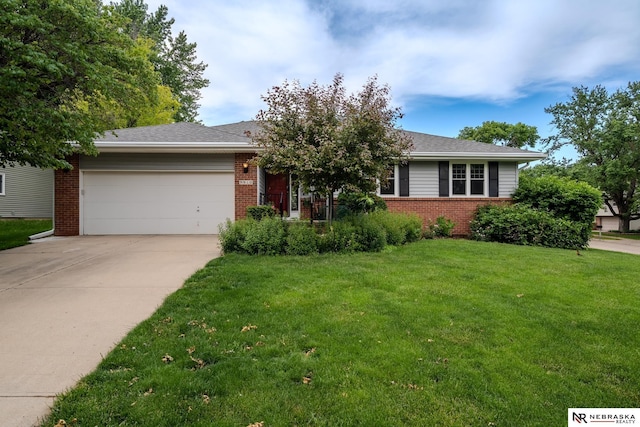 9910 Ohio St, Omaha, NE 68134 - view of front of home featuring a garage, brick siding, concrete driveway, and a front lawn