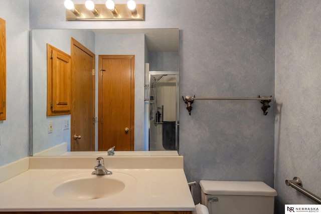 9910 Ohio St, Omaha, NE 68134 - full bathroom with toilet, vanity, and a shower