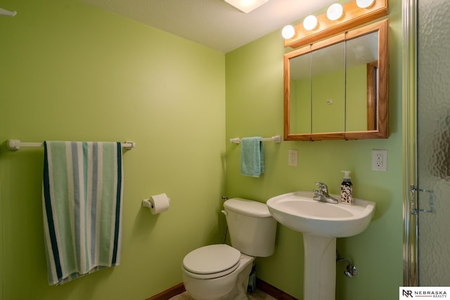 9910 Ohio St, Omaha, NE 68134 - bathroom featuring toilet and baseboards