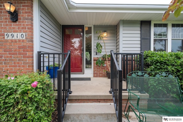 9910 Ohio St, Omaha, NE 68134 - property entrance with a porch and brick siding