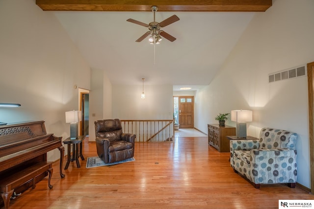 9910 Ohio St, Omaha, NE 68134 - living area with high vaulted ceiling, ceiling fan, light wood finished floors, an upstairs landing, and beamed ceiling