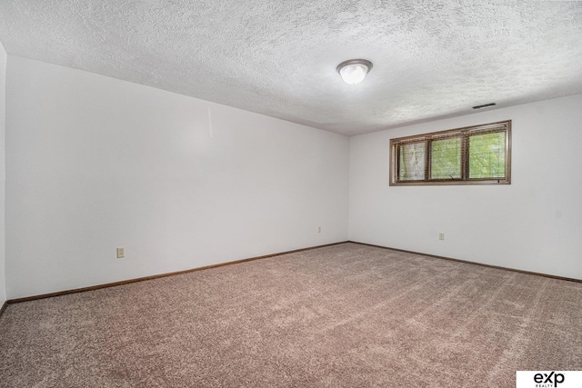 1214 Happy Hallow Ct, Plattsmouth, NE 68048 - spare room featuring carpet flooring, a textured ceiling, and baseboards