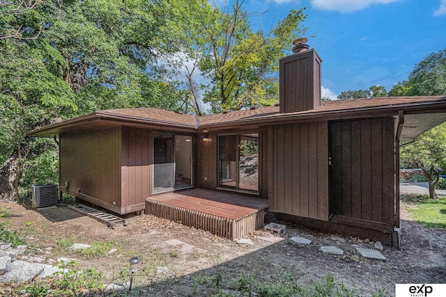 1214 Happy Hallow Ct, Plattsmouth, NE 68048 - back of house featuring a deck, a chimney, roof with shingles, and central AC