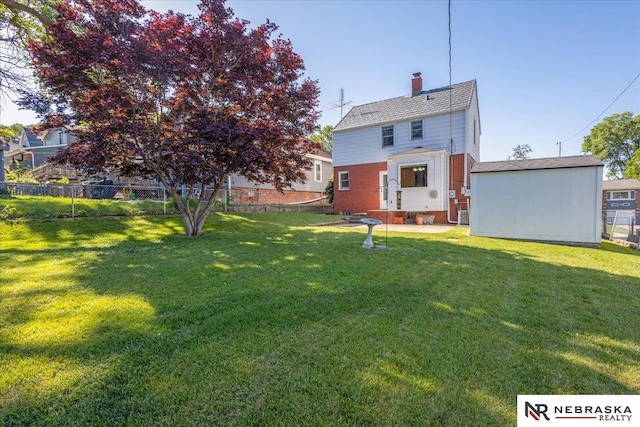 4542 Charles St, Omaha, NE 68132 - rear view of house featuring a chimney and brick siding