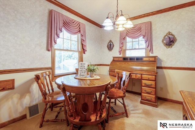 4542 Charles St, Omaha, NE 68132 - dining space featuring ornamental molding, a chandelier, and light carpet