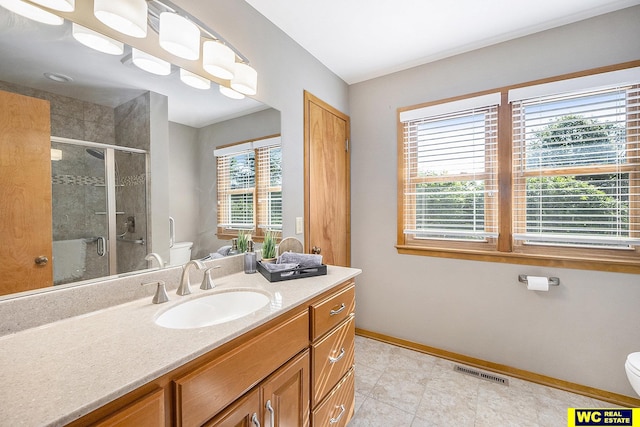 1341 Wilbur St, Blair, NE 68008 - full bath featuring toilet, vanity, a stall shower, baseboards, and tile patterned flooring