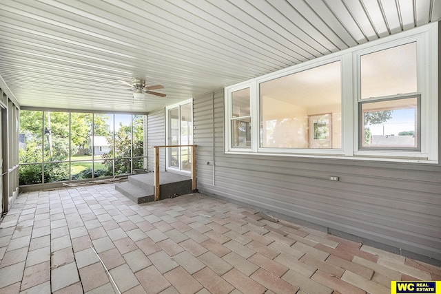 1341 Wilbur St, Blair, NE 68008 - unfurnished sunroom with a ceiling fan and plenty of natural light